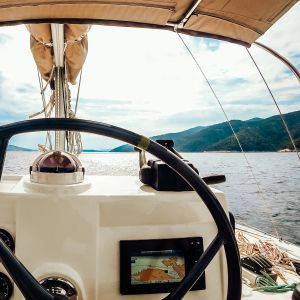 Ship control panel with steering wheel on the captain bridge